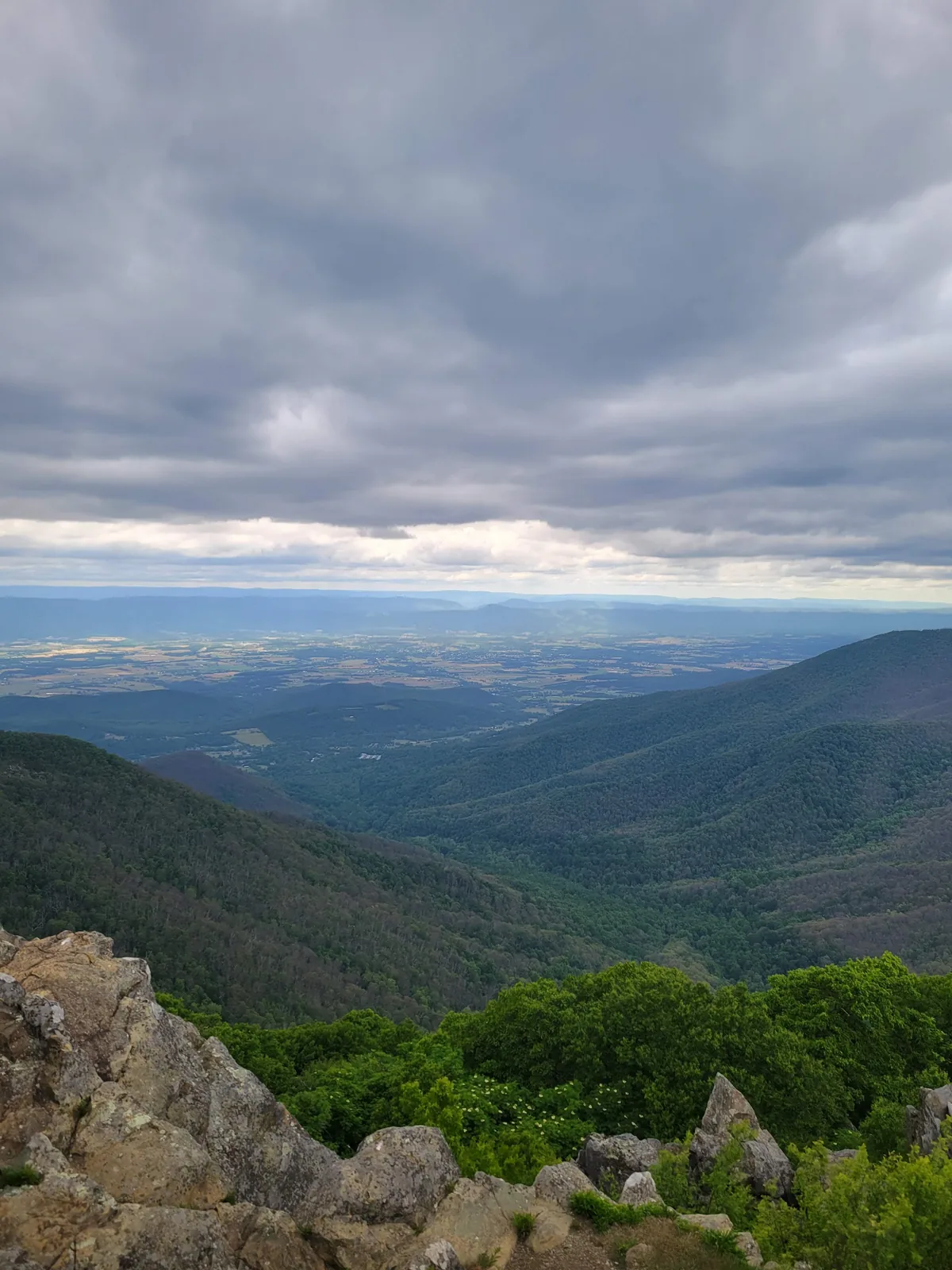 Mountain ridges under a cloudy sky