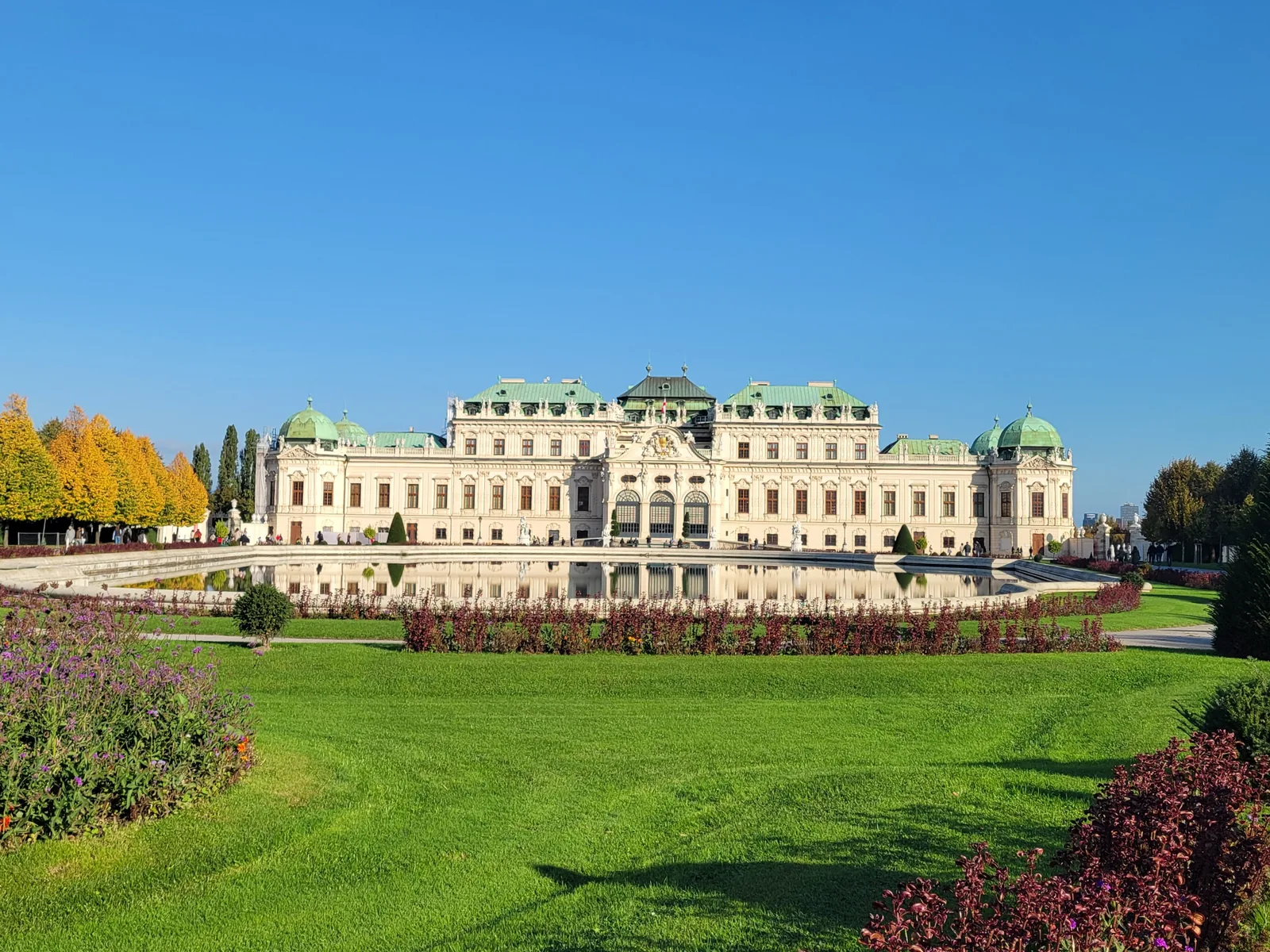 Grand palace behind a wide green lawn