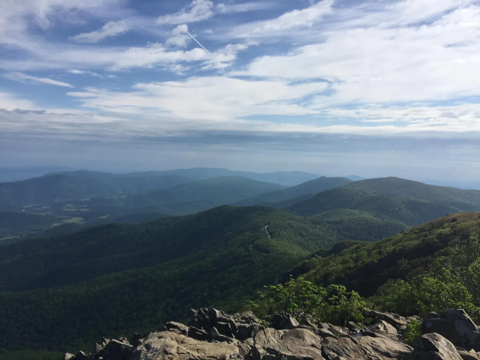 Layers of blue mountain ridges at sunset