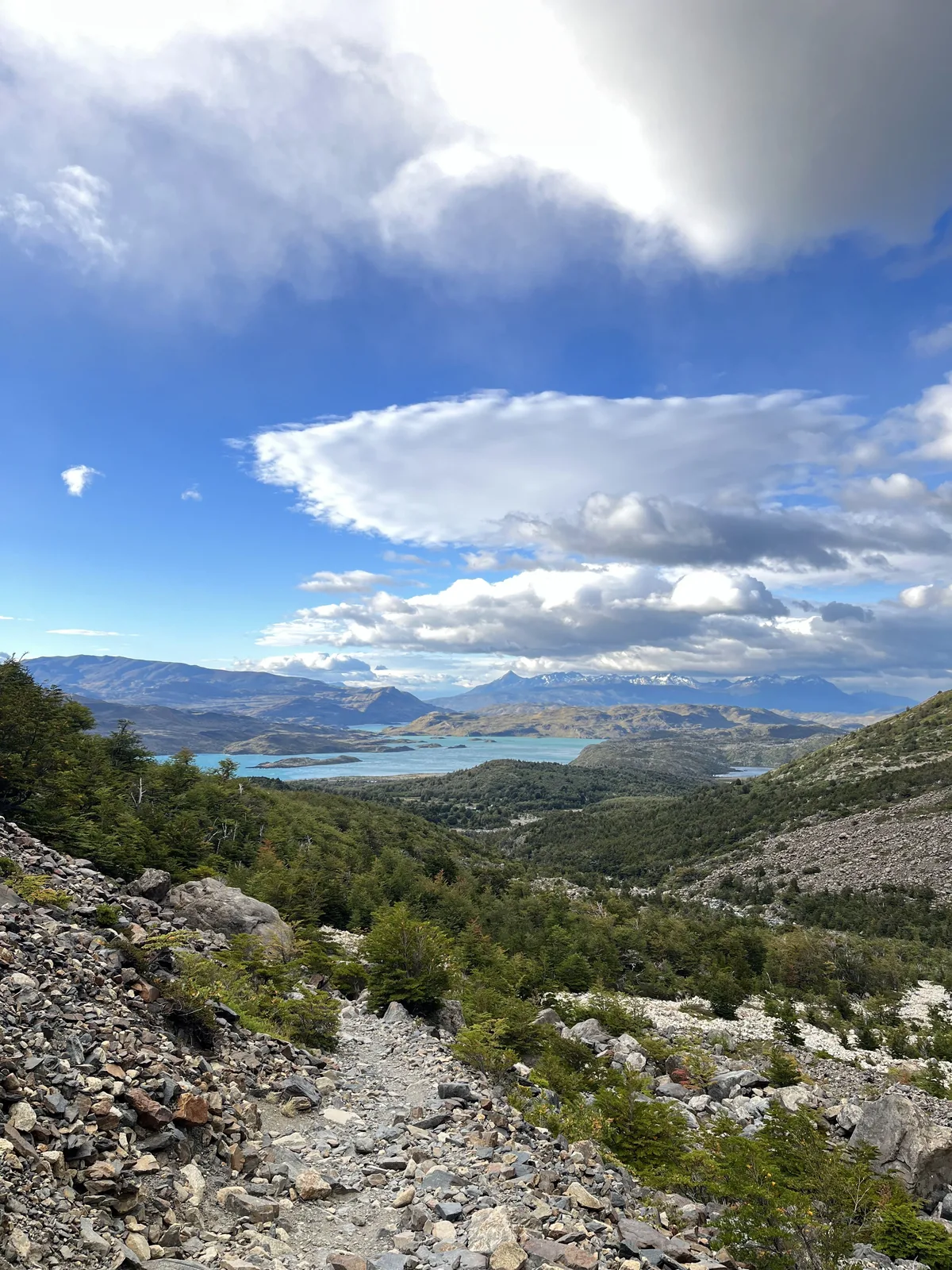 River winding through a golden valley beneath mountains