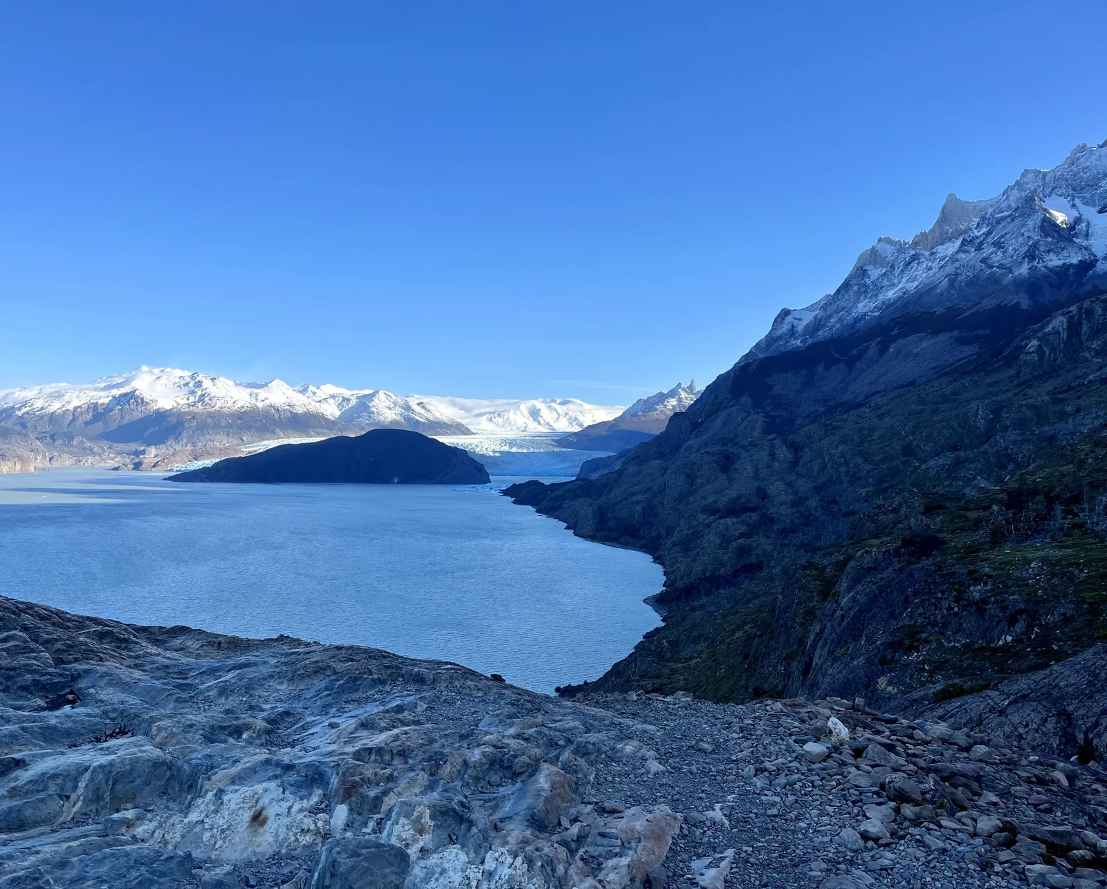 Cloud-filled valley below a winding mountain road