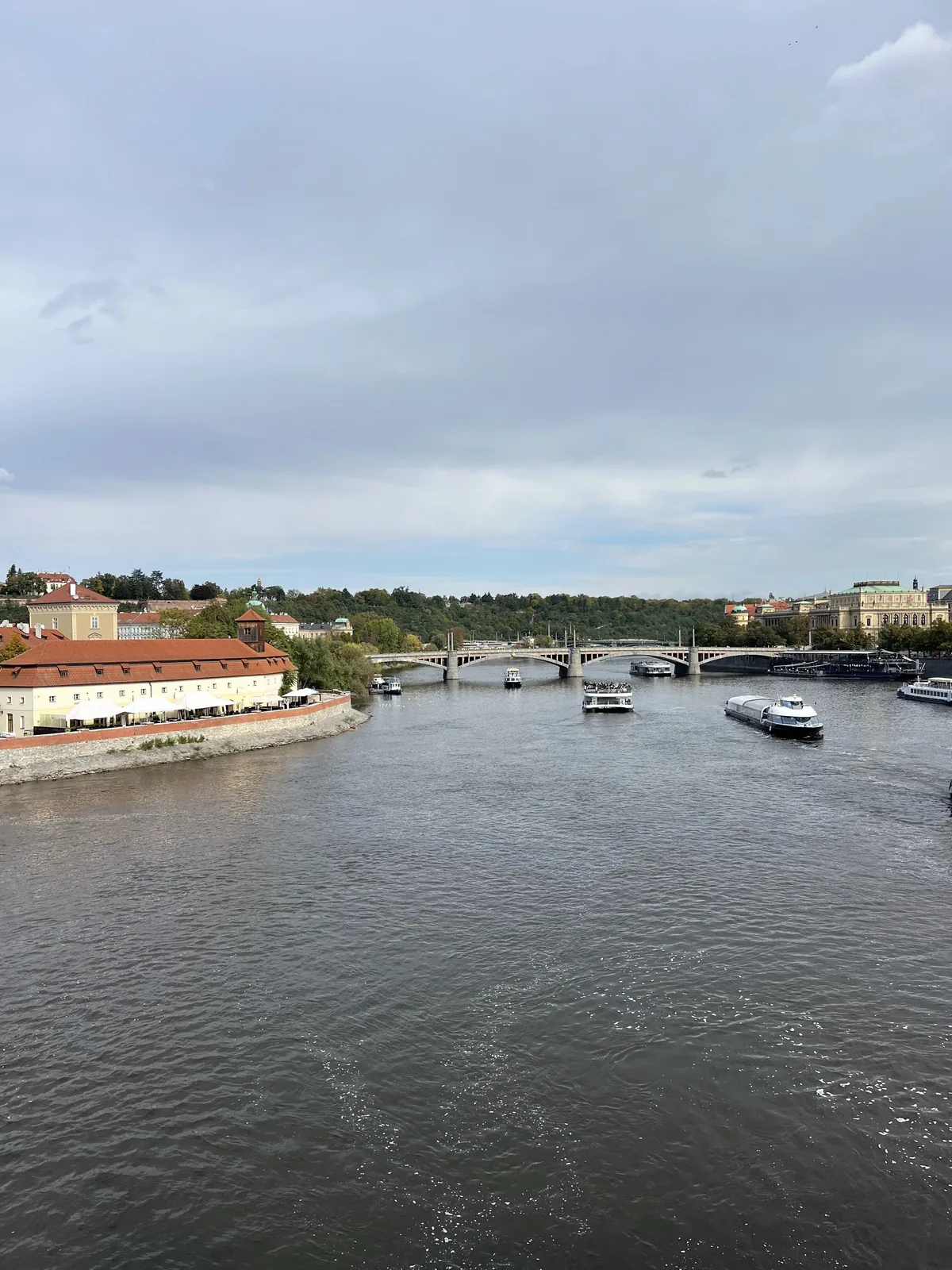 Distant sea cliffs under heavy gray clouds