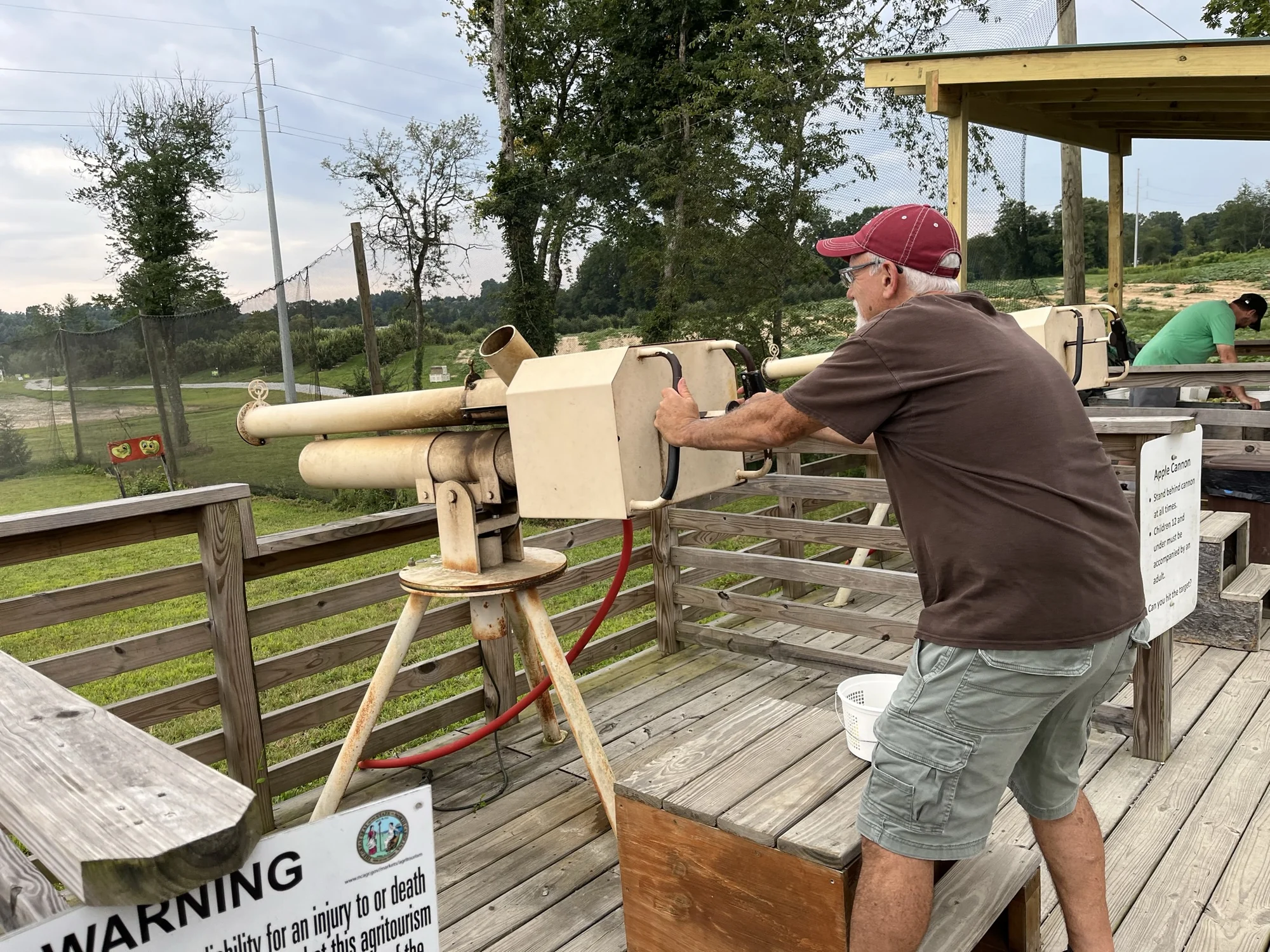 Sydney’s dad operating a tan apple cannon at Stepp’s.