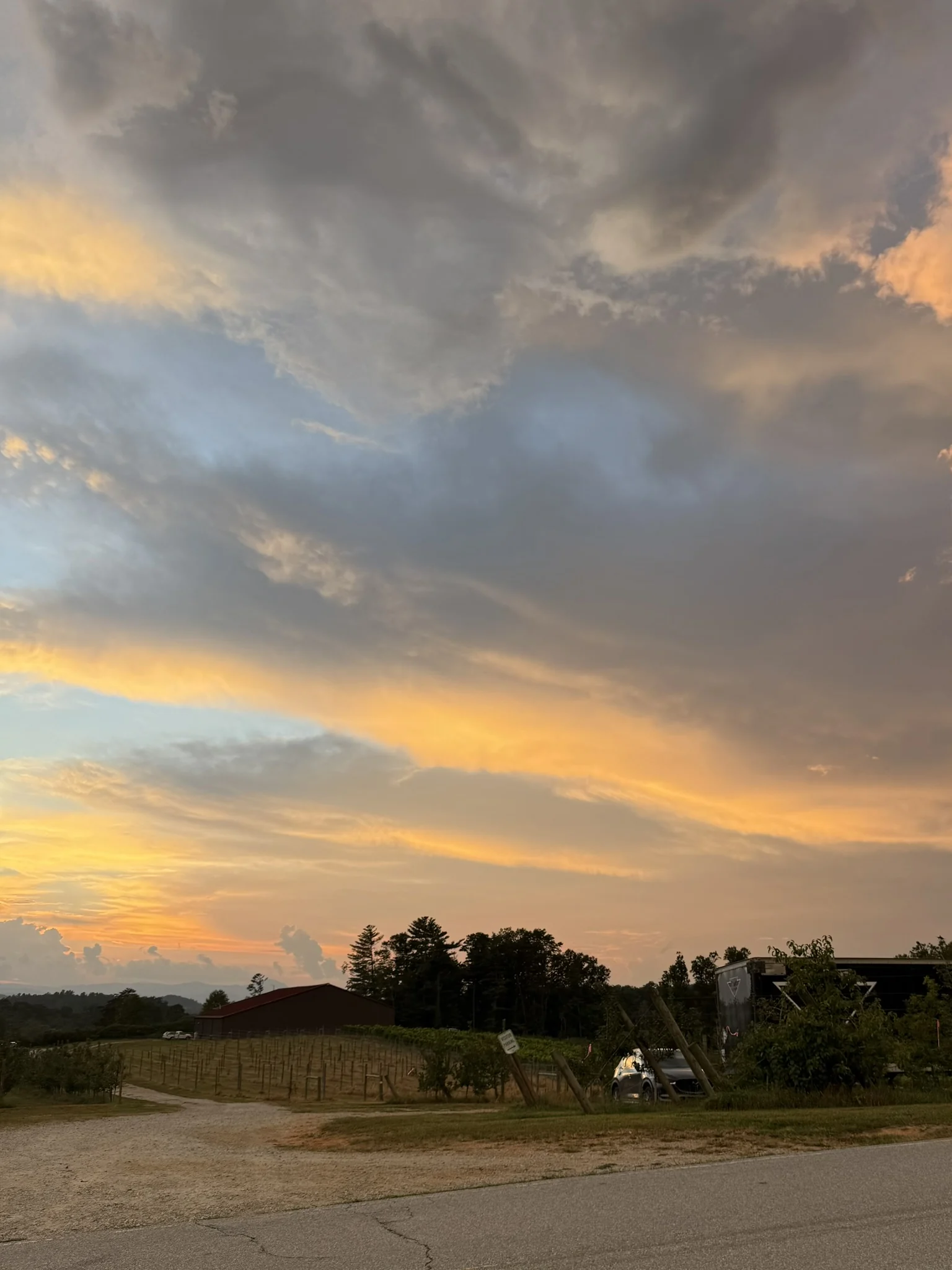 Gold and blue evening clouds above the fields outside Hendersonville.