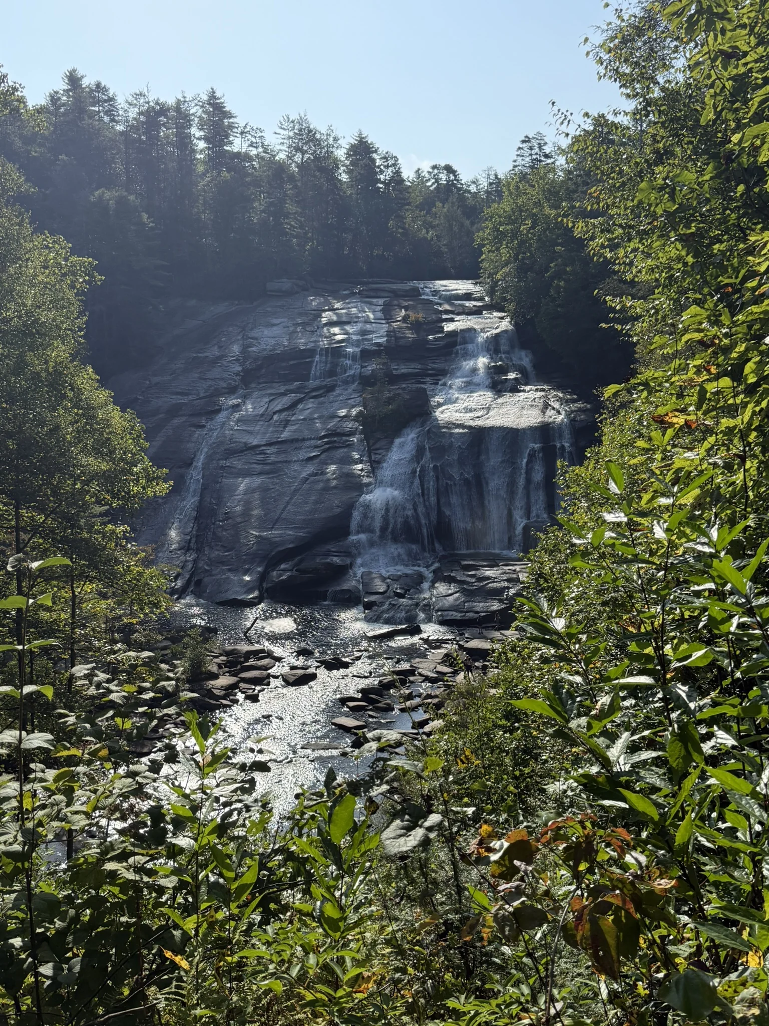 High Falls flowing down a steep rock face in DuPont State Recreational Forest.