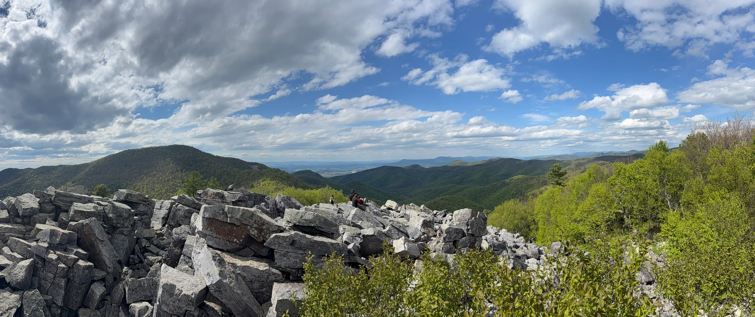 Blackrock Summit panorama with gray boulders and Shenandoah mountains under dramatic clouds.